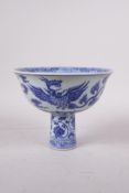 A Ming style blue and white porcelain stem bowl with phoenix decoration, Chinese, 4" high x 5"