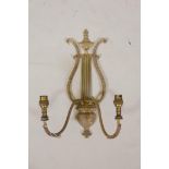 A gilt brass lyre shaped two branch wall sconce, 17" long