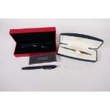 A boxed Ferrari fountain pen with refil, together with a boxed Cross ball point pen
