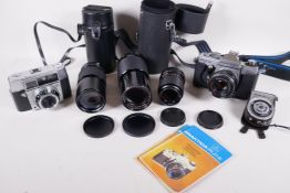A German Praktica PLC2 35mm cameral with a Pentacon 1.8/50 lens, a Pentacon 3.5/200 lens, a Carl