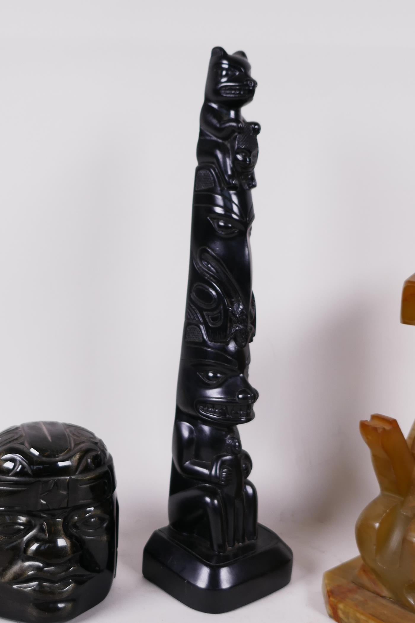 Two Mexican carved obsidian heads, a carved onyx seated figure 7" high, and a Canadian carved - Image 4 of 4