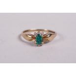 A 9ct yellow gold, emerald and diamond set ring, approx size N