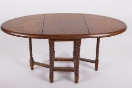 A doll's house oak gateleg table on barley twist supports, 7" high