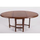 A doll's house oak gateleg table on barley twist supports, 7" high