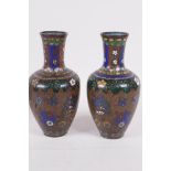 A pair of Oriental wireless cloisonne narrow necked vases, 6" high