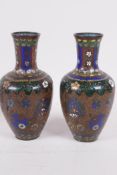 A pair of Oriental wireless cloisonne narrow necked vases, 6" high