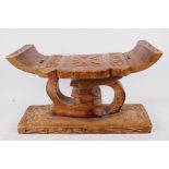 An African carved wood ceremonial stool, 7" high