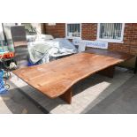 A bespoke mahogany plank top table raised on a plank end base, 12ft x 6ft