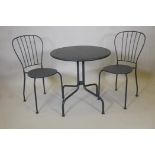 A metal bistro table and two chairs, table 28" high, 27" diameter (adaptions)