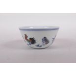 A doucai porcelain tea bowl with chicken decoration, Qianlong seal mark to base, 3" diameter