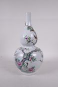 A Chinese polychrome porcelain double gourd vase, decorated with a peach tree and cranes, Qianlong