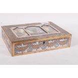 A silver plated jewellery box with raised decoration of swags and garlands of flowers, the cover