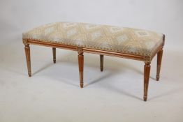 A stained and polished beechwood window seat with parcel gilt decoration, 47" x 20" x 18"