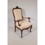 A C91th French walnut open arm chair, the shaped back with carved crest, scroll arms and shaped