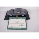 A Guiloy Die Cast model of an Aston Martin DB7, 10" long, No 0049 with certificate from Aston Martin