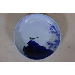 Oriental ceramic bowl, painted with magpie on a rock, marked to base, 14" diameter