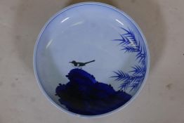 Oriental ceramic bowl, painted with magpie on a rock, marked to base, 14" diameter