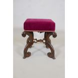 A C19th rosewood stool, raised on carved and shaped supports united by twisted cross stretchers, 15"