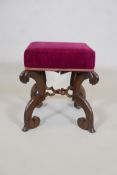 A C19th rosewood stool, raised on carved and shaped supports united by twisted cross stretchers, 15"