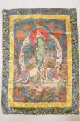 A Tibetan tanka depicting a green deity, 31" x 42"