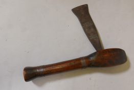 A tribal axe with wood shaft and metal bindings and head, 13" long