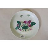 A Chinese Republic period ceramic dish with raised enamel decoration of a lotus flower, seal mark to