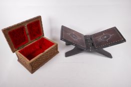 A hardwood folding Koran stand inlaid with mother of pearl, 17" x 7", together with a carved wood