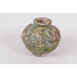 An antique green glazed terracotta pot with raised dragon decoration, A/F, 2" high