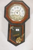 An eight day 'Regulator' drop dial wall clock, in a faux bois painted case, possibly Seikosha, 22"