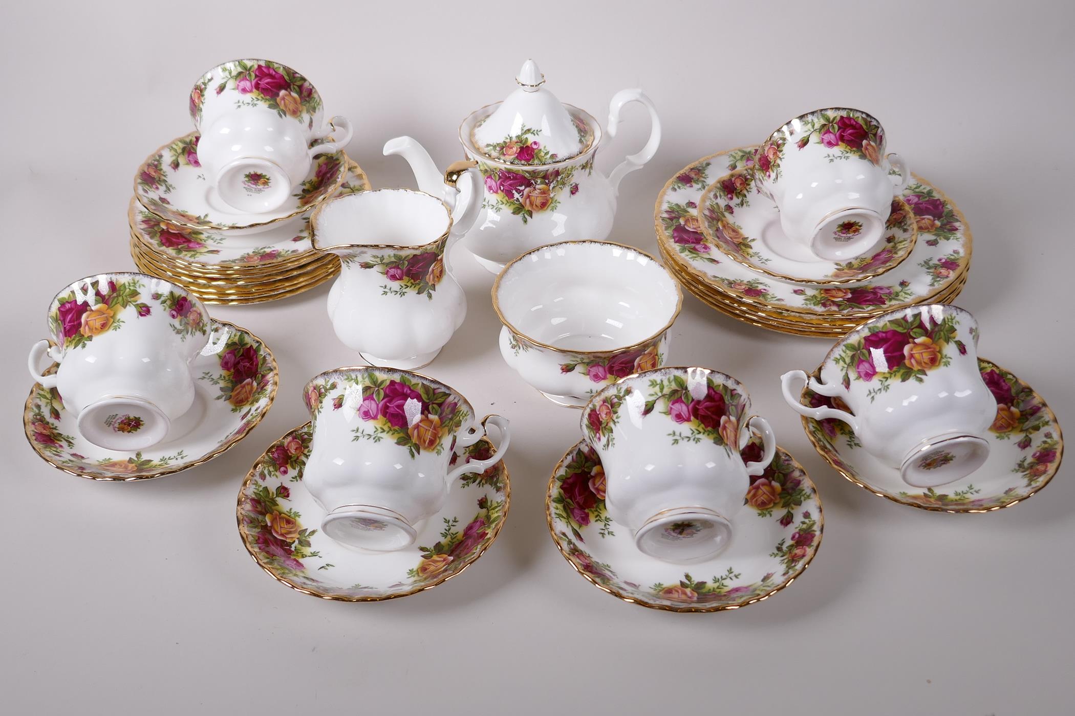 A Royal Albert 'Old Country Rose' pattern tea set comprising six cups and saucers, seven x 6"