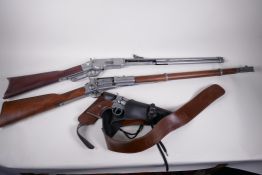 Two replica American western rifles and a replica Colt revolver in holster and belt