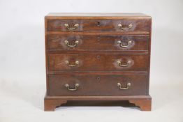 A Georgian mahogany caddy top chest with four graduated long drawers, each with scratch moulded