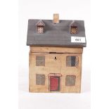 A wood box in the form of a cottage with naive painted decoration, 6" x 6" x 8"