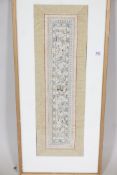A framed C20th Chinese silk sleeve band, 23" x 7"