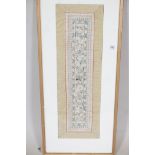 A framed C20th Chinese silk sleeve band, 23" x 7"