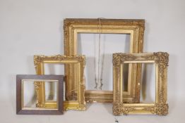 Three C19th gilt and gesso picture frames, some loses, largest 26" x 23", and a smaller oak frame,