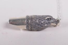 A 925 silver whistle in the form of a bird of prey, on a chain, 2" long