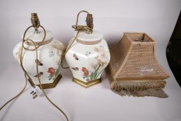 A pair of Chinese pottery hexagonal table lamps, decorated with flowers and butterflies, signed, 15"