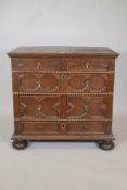 A Queen Anne oak chest, comprising four moulded front drawers and bobbin turned mouldings to the