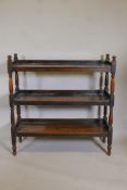 A C19th three tier buffet on turned end supports, 41" high, 47" wide, 13" deep