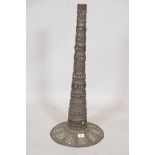 A Sino Tibetan metal stand, inset with stones and applied copper plaques, A/F losses, 30" high