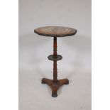 A C19th rosewood lamp table, raised on a turned column and platform base, adapted with a Chinese