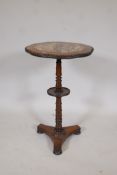 A C19th rosewood lamp table, raised on a turned column and platform base, adapted with a Chinese