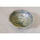 A Chinese crackleware ceramic bowl, decorated in blue with a phoenix, four character mark to base,