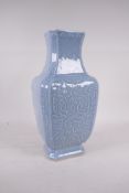 A Chinese duck egg blue glazed porcelain vase with raised archaic style decoration, impressed seal
