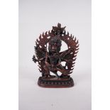 A Tibetan coppered metal figure of a wrathful deity and lover, impressed double vajra mark to