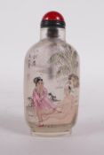 A reverse decorated glass snuff bottle decorated with an erotic scene, character inscription