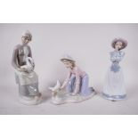 Two Nao porcelain figurines, 'A girl praying', model number 1224, and 'A girl caressing a dove',
