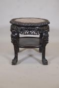 A C19th Chinese hardwood two tier table, with inset marble top, carved decoration and pierced