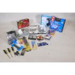 A quantity of tools, digital and analogue multi meters, drill bits, cordless drills, rotary mini